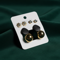 Black Earrings Set Dark Forest Green Background